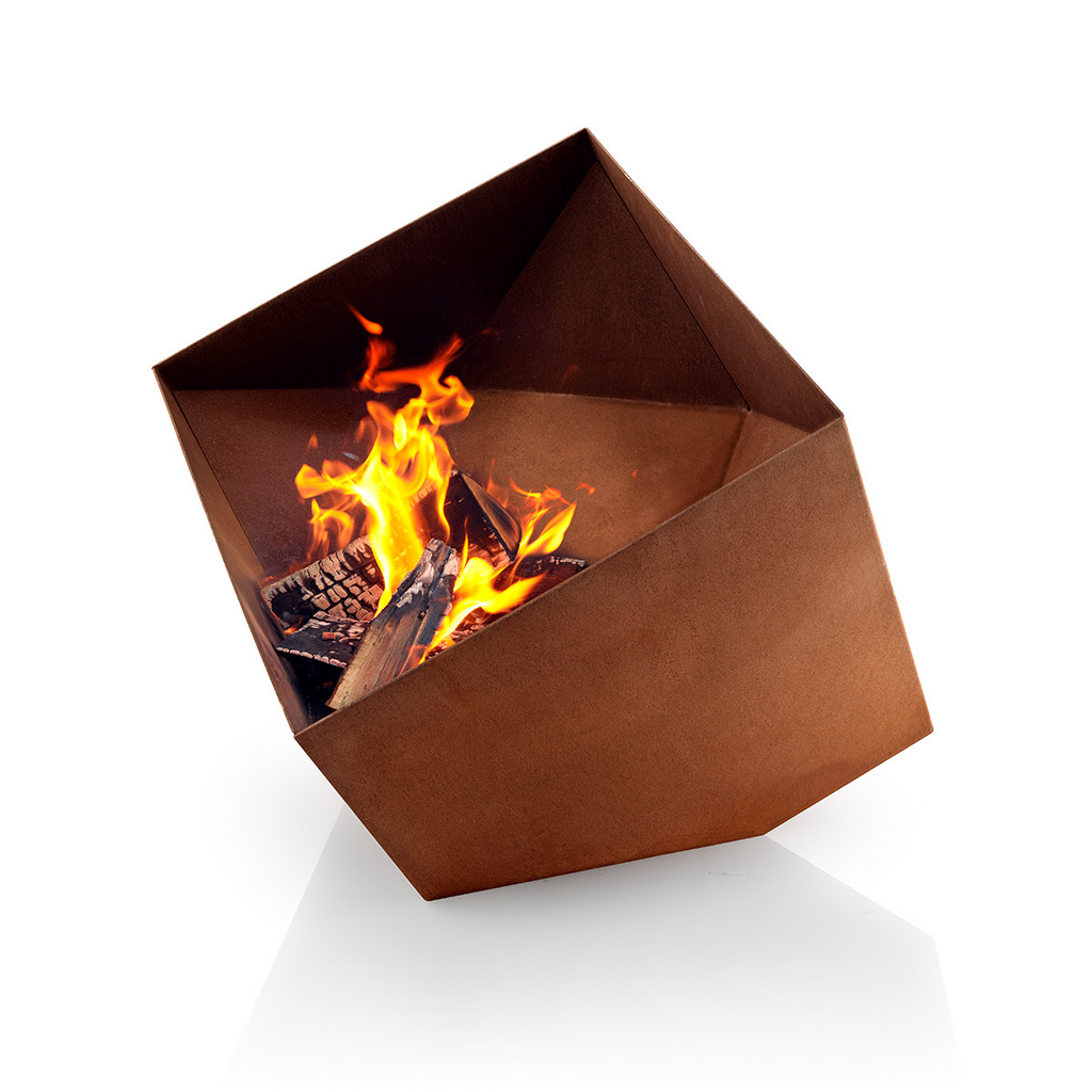 Eva Solo corten steel Firecube Fire Pit with fire burning