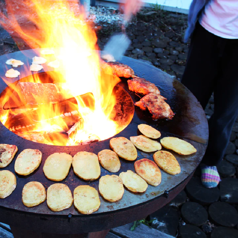 Cooking potato and chicken on a Teppanyaki style Ringgrill BBQ Grill