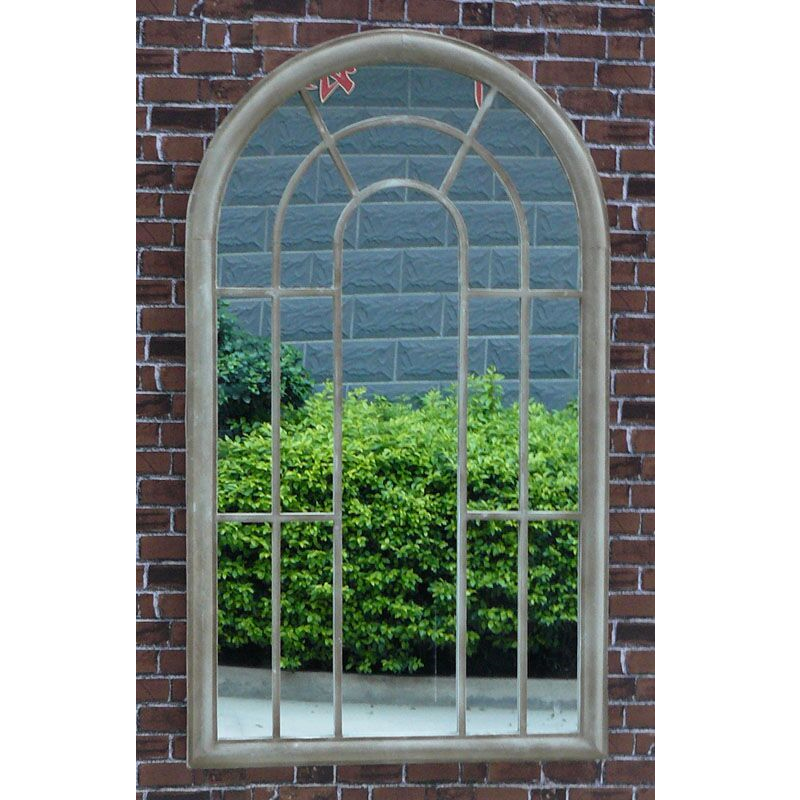 Tracey Garden Window Mirror on brick wall with hedges in reflection