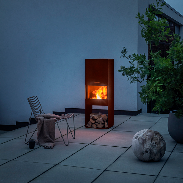 Firebox Garden Wood Burner Fire Pit burning a fire on a patio area