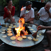 people cooking around the Yagoona Ringgrill BBQ & Goanna Fire Pit Australia