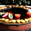 Food cooking on Yagoona Ringgrill BBQ & Goanna Fire Pit Australia