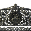 Close up image of the cameo detail in the Cameo Cast Iron Bench small size in black gold colour