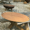 Fire Pit Metal Lids one on a fire pit and one on a wooden bench