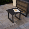 Vivara Outdoor Side Table in Charcoal colour with a magazine