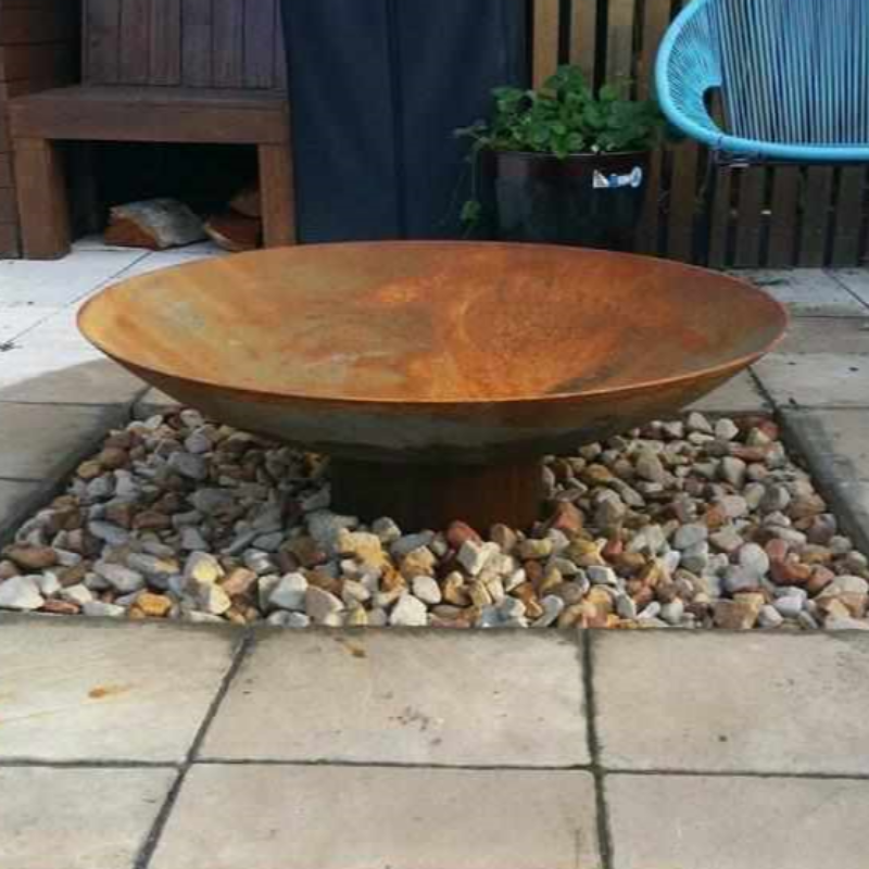 Cauldron 80cm Cast Iron Fire Pit in an outdoor area