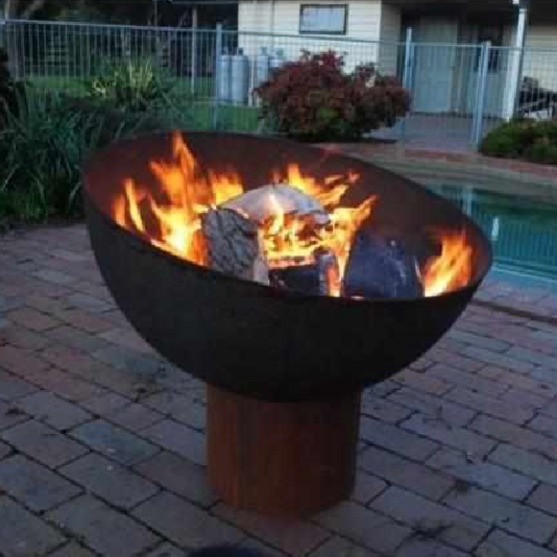 The Goblet Fire Pit at poolside with fire burning