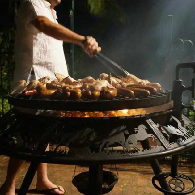 Sausages and wings cooking on the Ultimate BBQ Fire Pit 