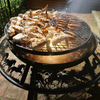 The Ultimate BBQ Fire Pit with sausages and chicken wings cooking