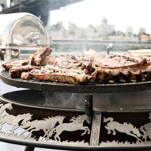 The Ultimate BBQ Fire Pit with meat being grilled