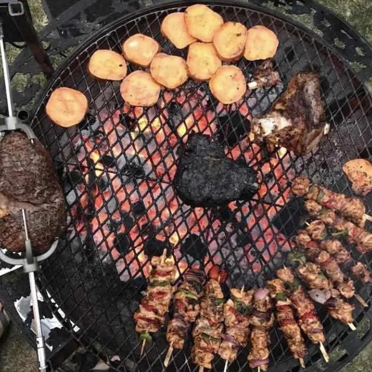 The Ultimate BBQ Fire Pit cooking up a feed