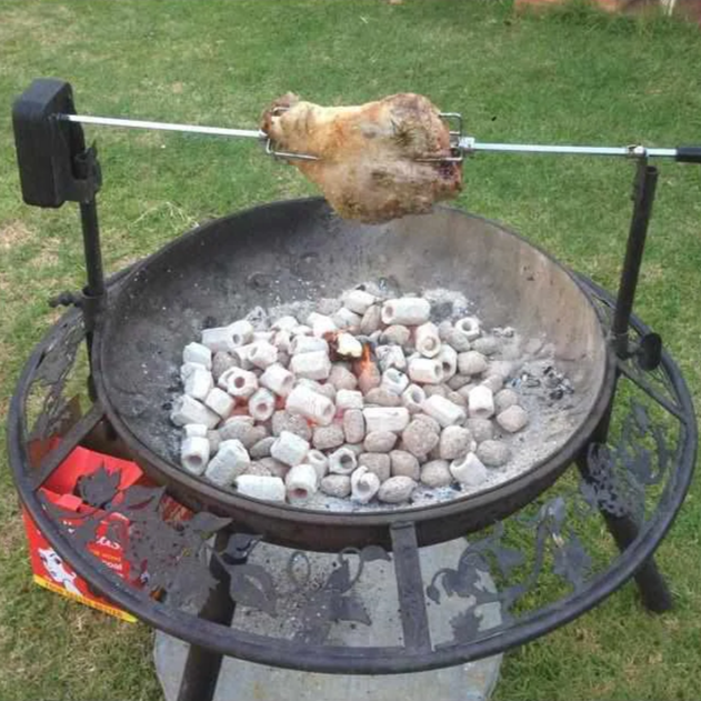 The Ultimate BBQ Fire Pit with a lamb roast cooking on spit